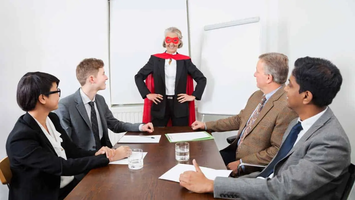 office team meeting with super costume
