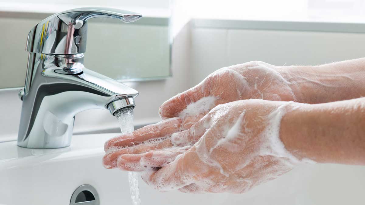 washing hands in sink
